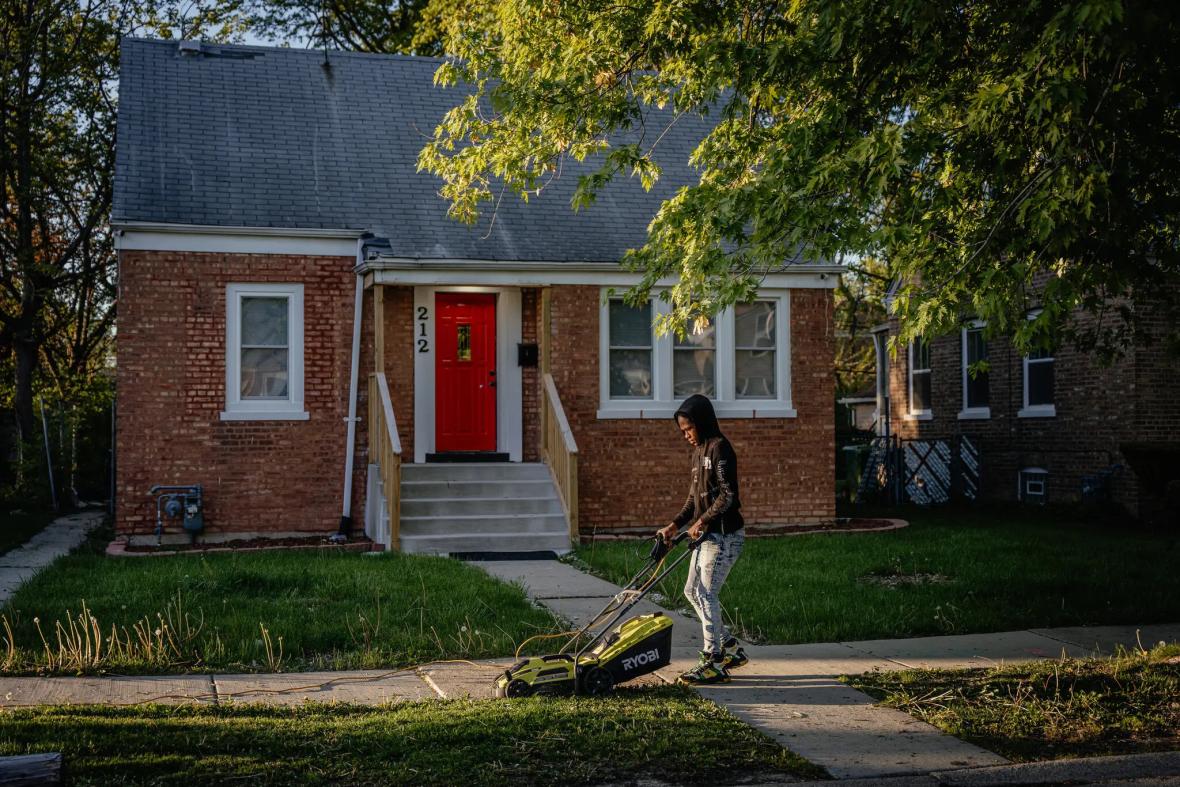 A neighbor mowing the lawn of the house in Dalton, IIll., that was the childhood home of newly elected Pope Leo XIV, on Thursday A neighbor mowing the lawn of the house in Dalton, IIll., that was the childhood home of newly elected Pope Leo XIV, on Thursday